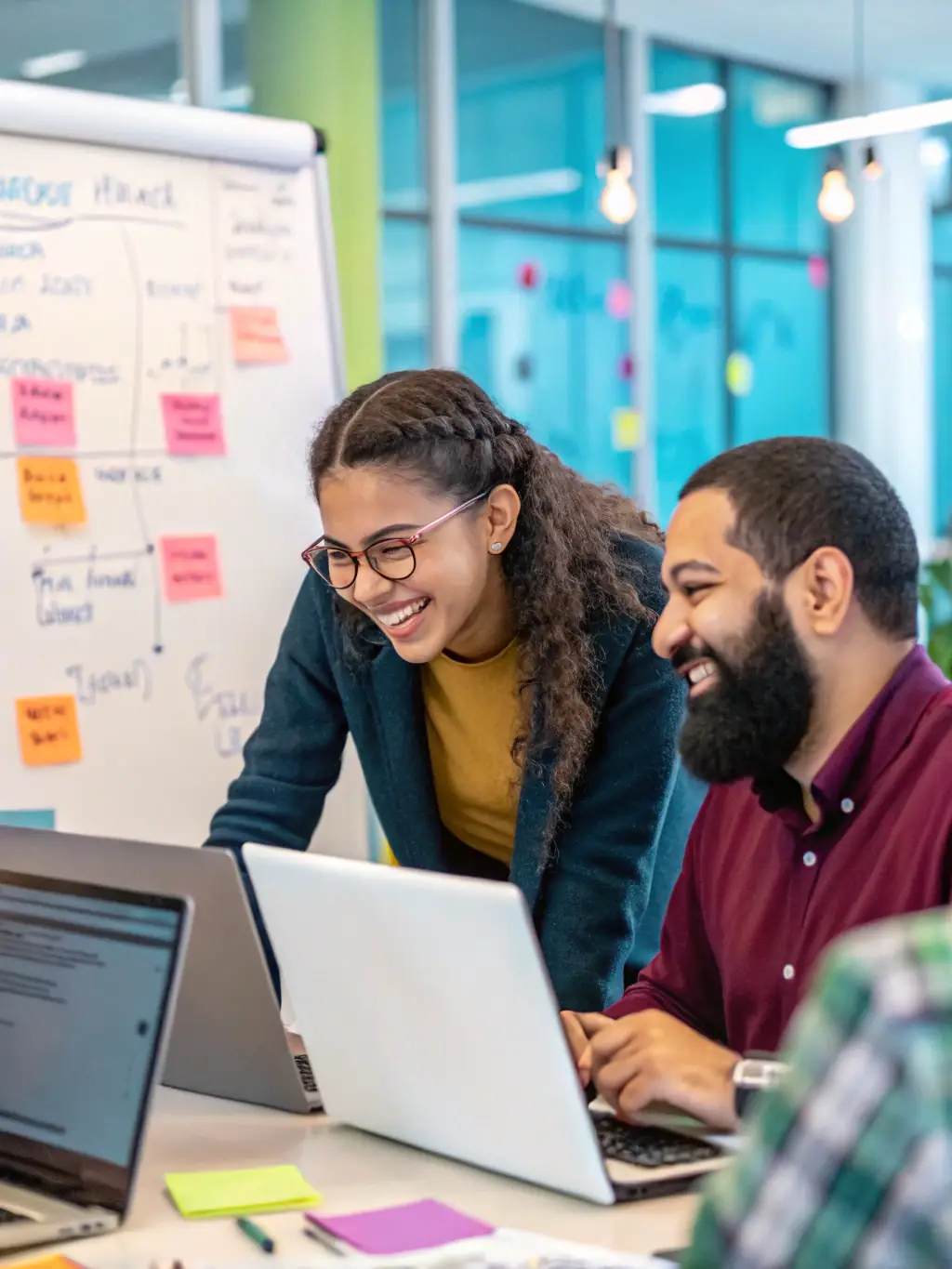 A diverse team of software developers collaborating on a project, showcasing Agdbrix's commitment to innovation and technology.